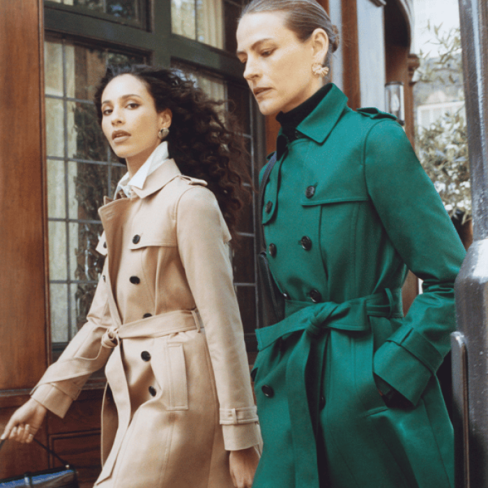 A woman in a green coat and a woman in a beige coat modelling the Hobbs workwear collection.