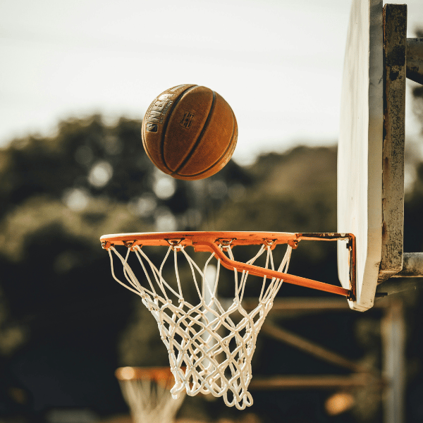 A basketball landing in a hoop